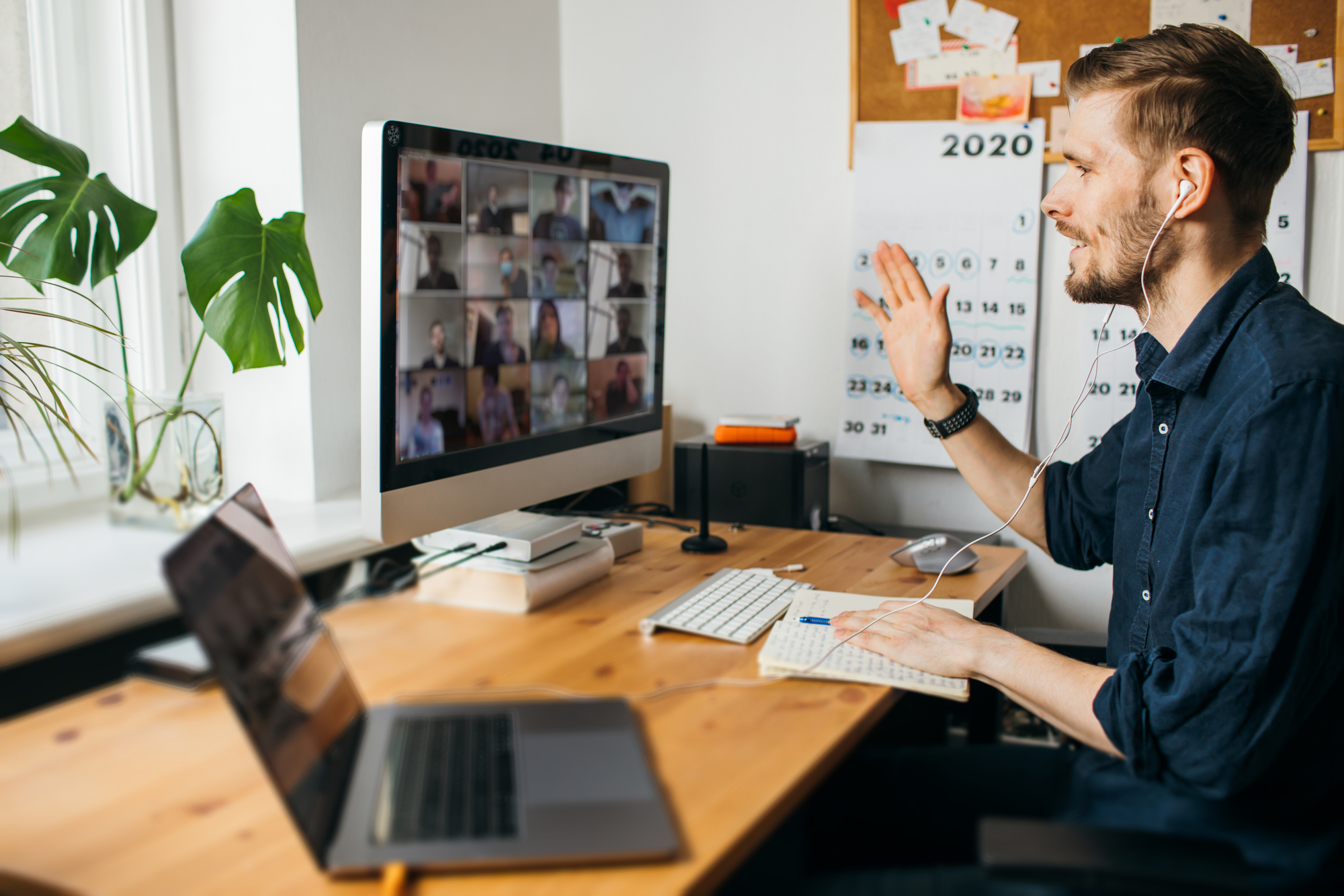 man is working on a Zoom meeting